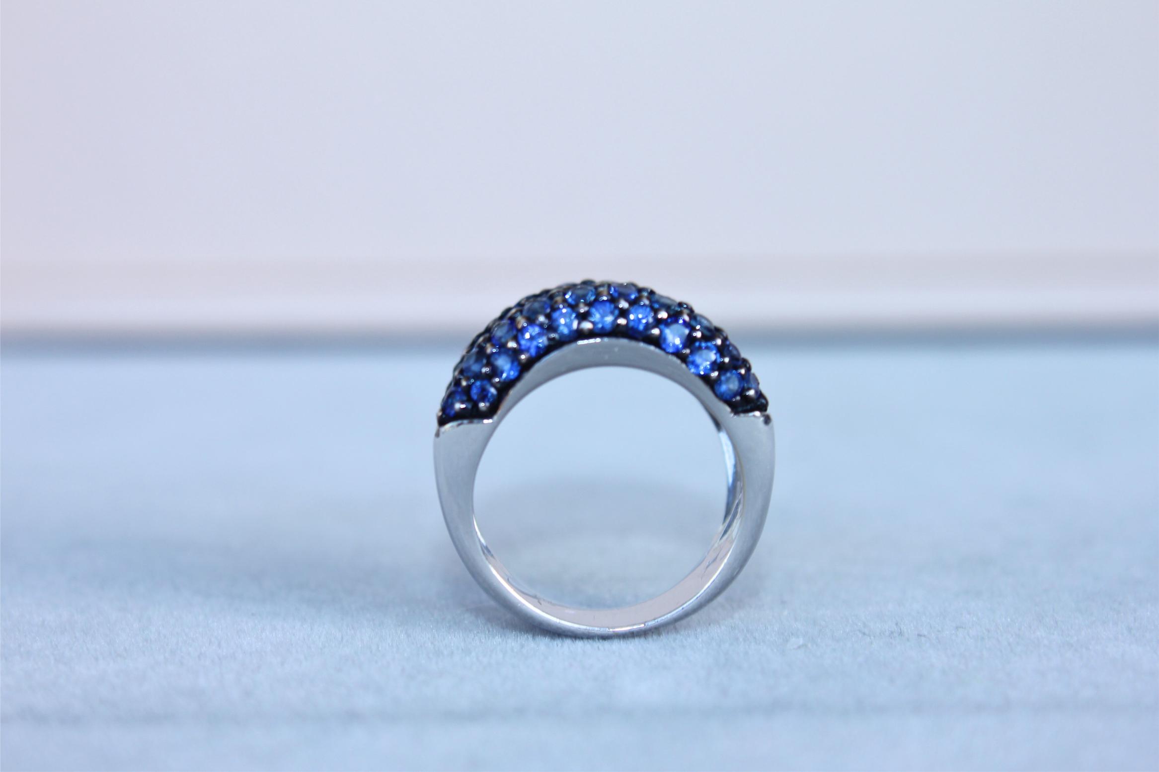Round Diamond Bezel Set Blue Sapphire Pave Set 18 Karat White Gold Unique Ring