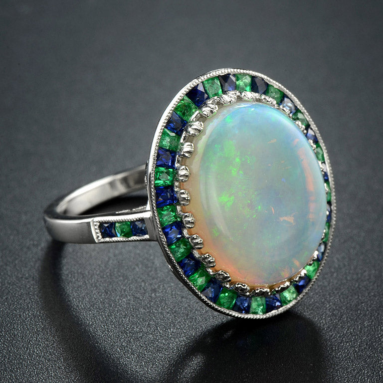 White Oval Cabochon Opal with Emerald & Sapphire Fancy Halo Set White Gold Ring