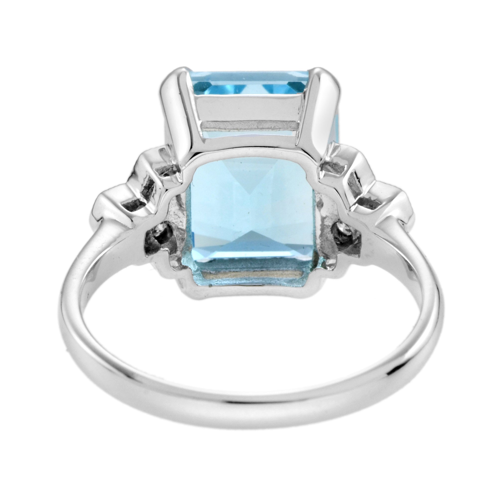 Emerald Cut Blue Topaz & Diamond Solitaire 9K White Gold Ring