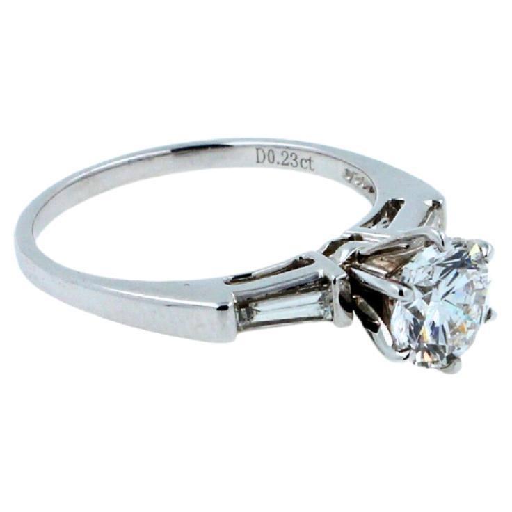 1.00 carat round shape brilliant cut diamond 18k white gold baguette sides ring