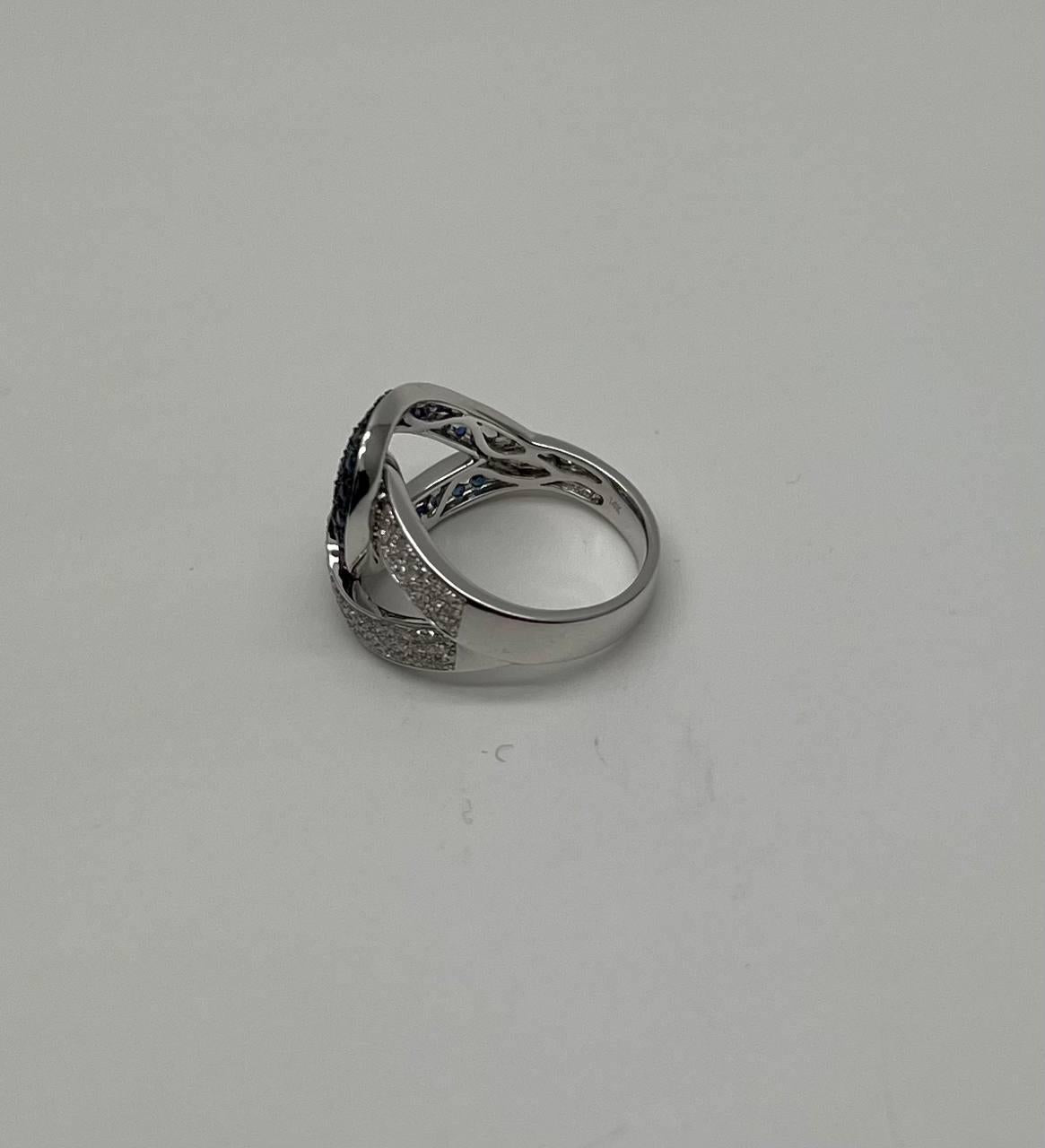 Intertwining Blue Sapphires Diamonds Interlocking Shapes White Gold Fashion Ring