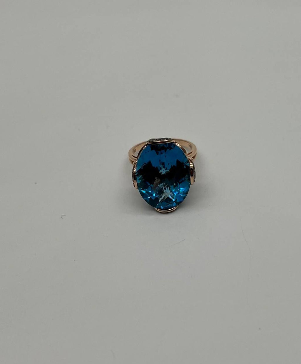 Oval Shape Swiss Blue Topaz 14K Rose Gold Champagne Halo Cocktail Ring