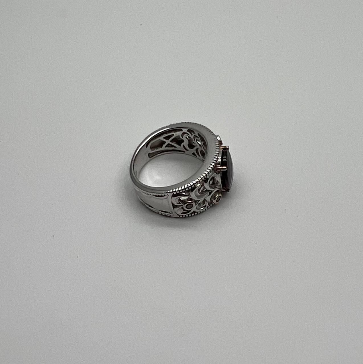 dark red garnet 14k white gold statement sculptural grooves waves fleur ring