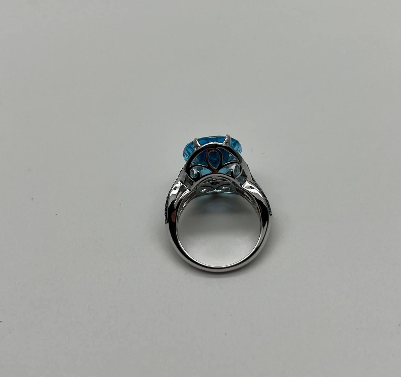 Oval Cut Blue Topaz Intertwining Sapphire Diamond Halo White Gold Statement Ring