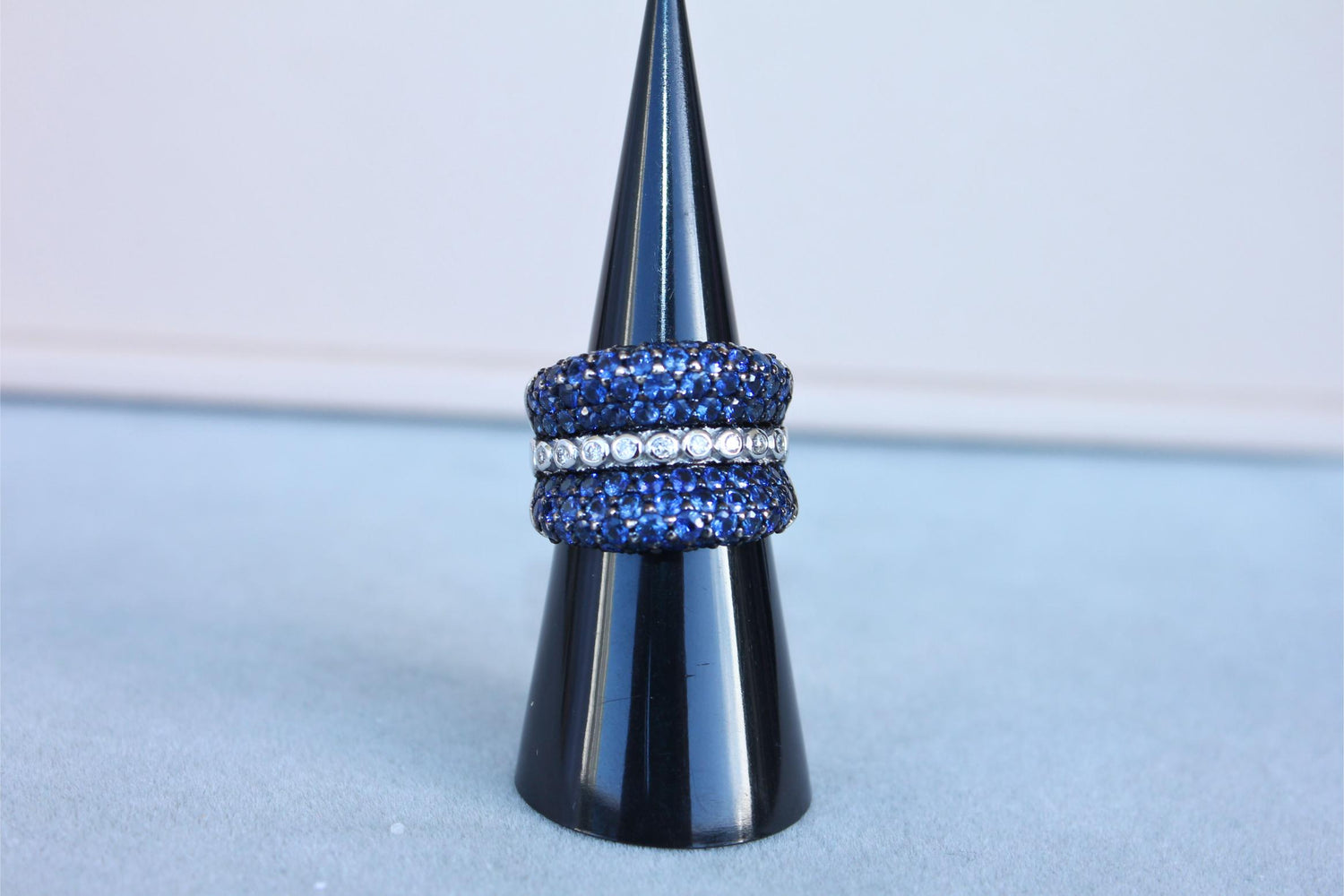 Round Diamond Bezel Set Blue Sapphire Pave Set 18 Karat White Gold Unique Ring