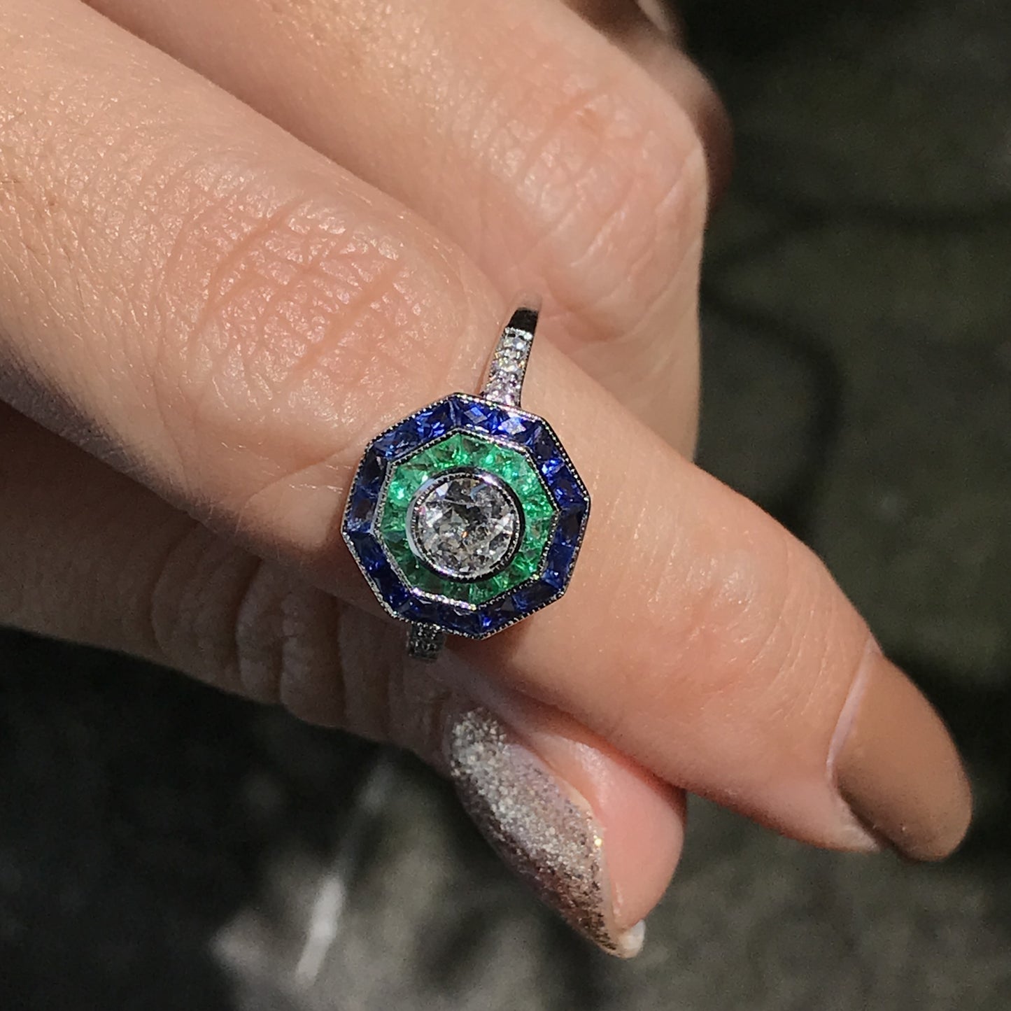 art deco style diamond with blue sapphire & green emerald halo white gold ring