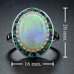 White Oval Cabochon Opal with Emerald & Sapphire Fancy Halo Set White Gold Ring
