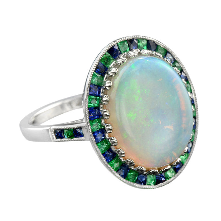White Oval Cabochon Opal with Emerald & Sapphire Fancy Halo Set White Gold Ring