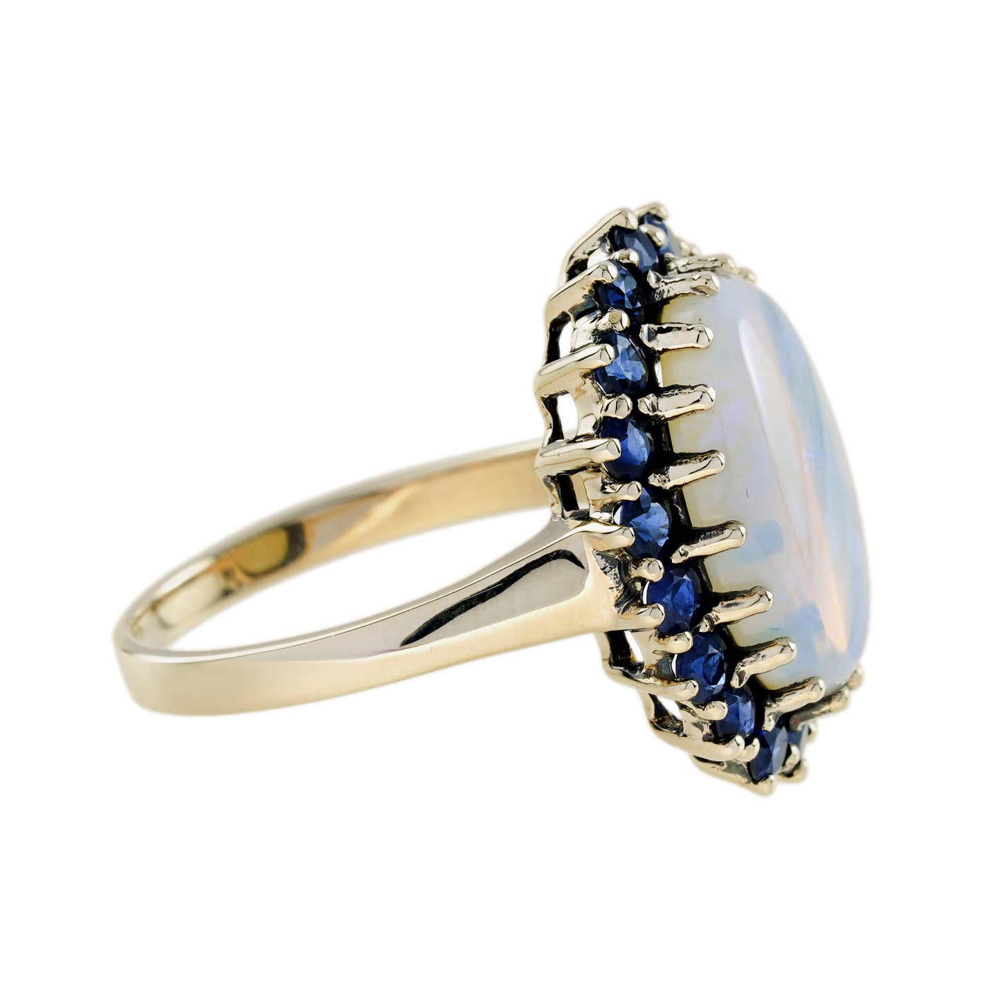 oval white opal with blue sapphire vintage style 9kt yellow gold halo set ring