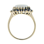 Oval White Opal with Blue Sapphire Vintage Style 9KT Yellow Gold Halo Set Ring