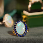 Oval White Opal with Blue Sapphire Vintage Style 9KT Yellow Gold Halo Set Ring