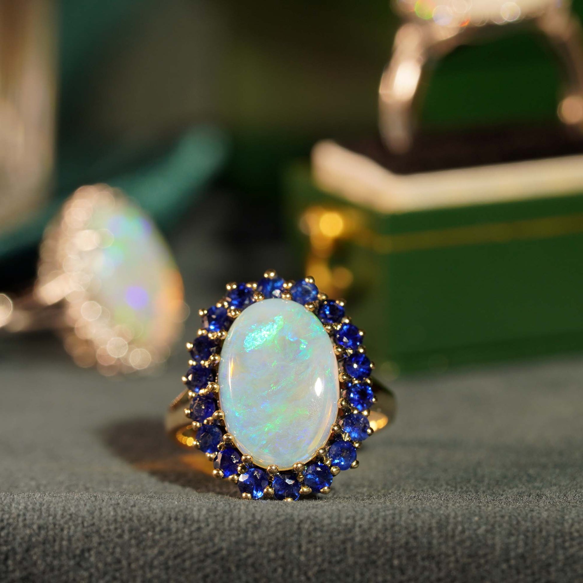 Oval White Opal with Blue Sapphire Vintage Style 9KT Yellow Gold Halo Set Ring