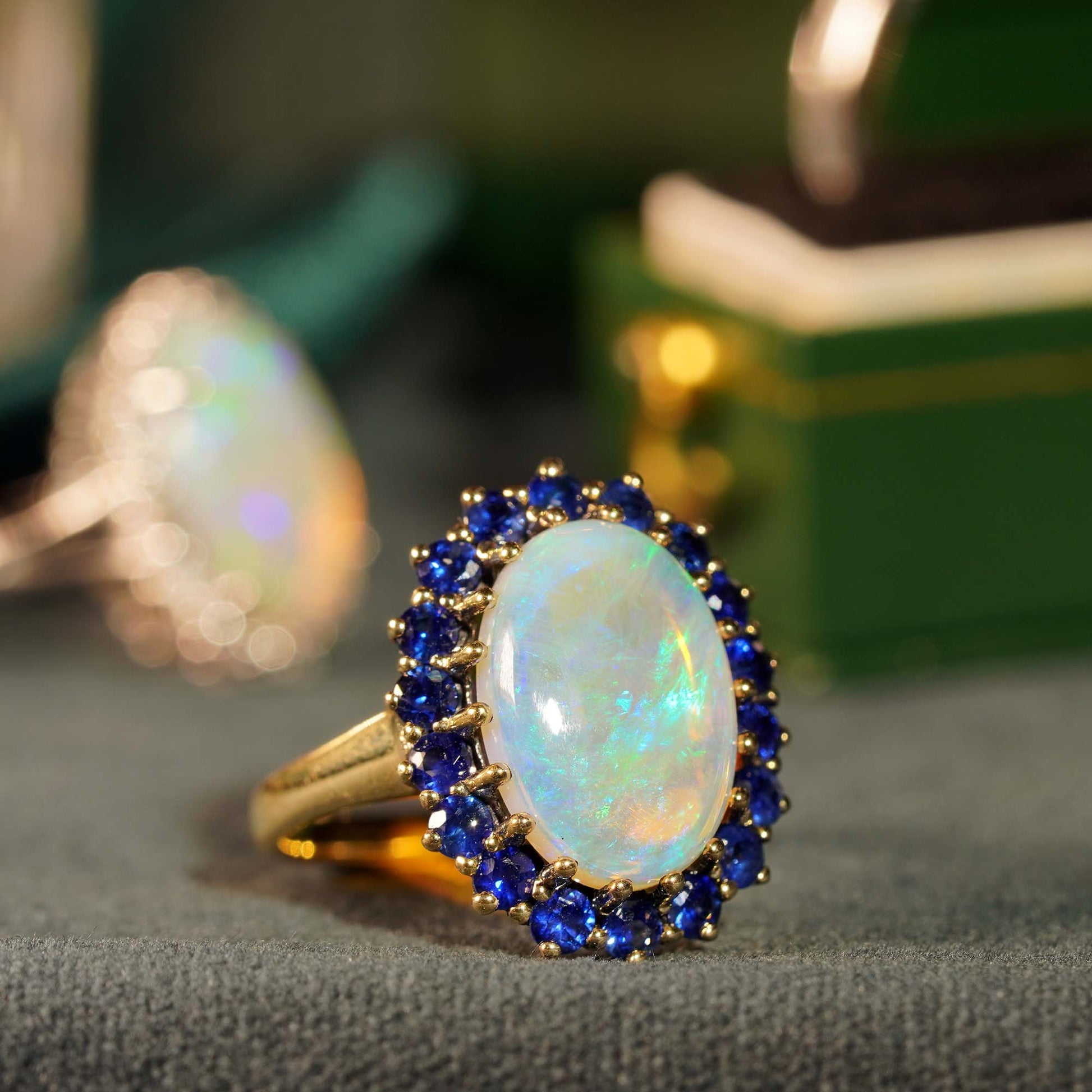Oval White Opal with Blue Sapphire Vintage Style 9KT Yellow Gold Halo Set Ring