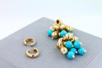 Blue Turquoise Diamonds Golden Sphere Bells Motif Two Tone Gold Huggie Earrings