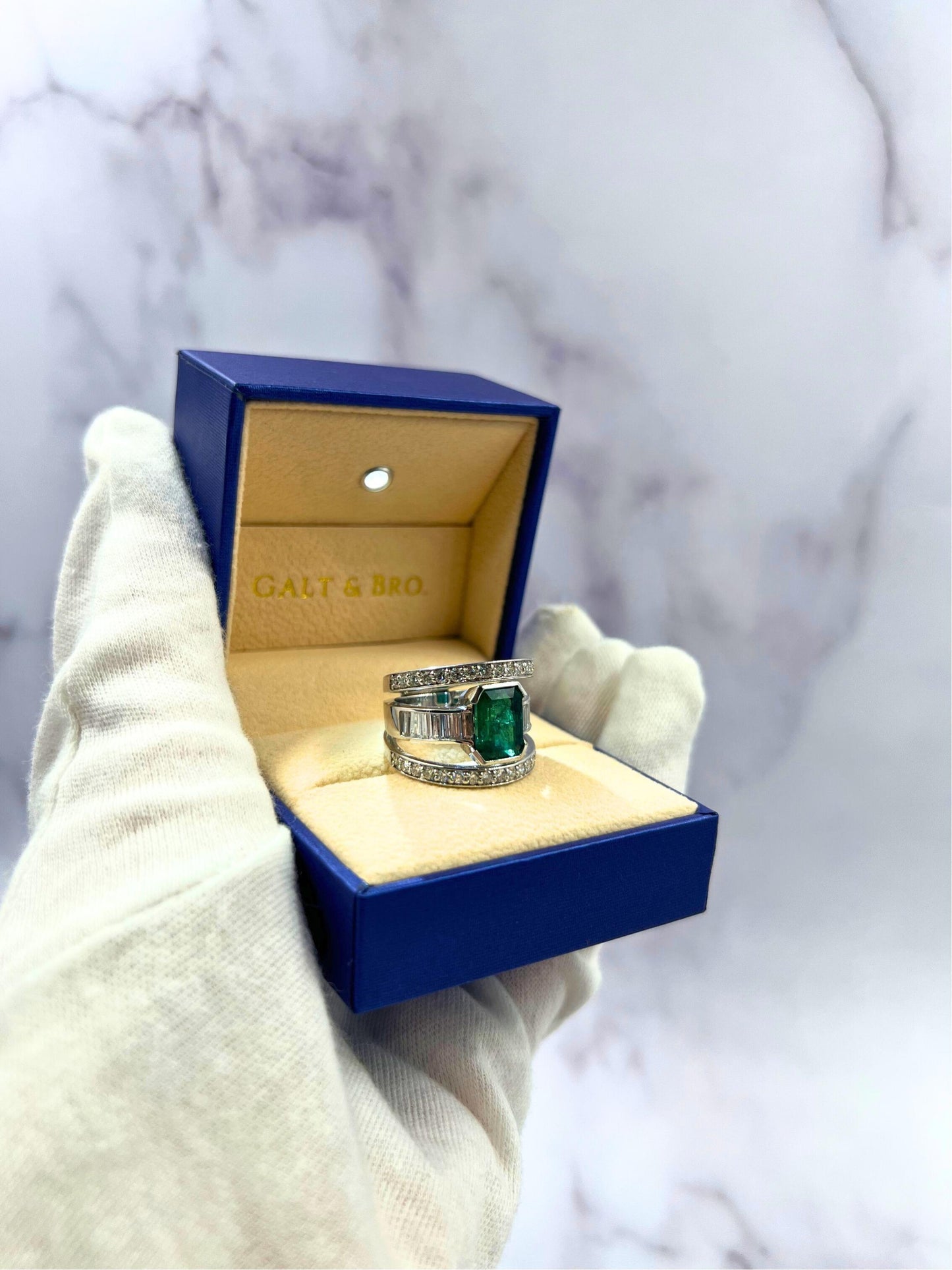 zambian emerald 18 karat white gold full finger bezel diamond baguette rows ring