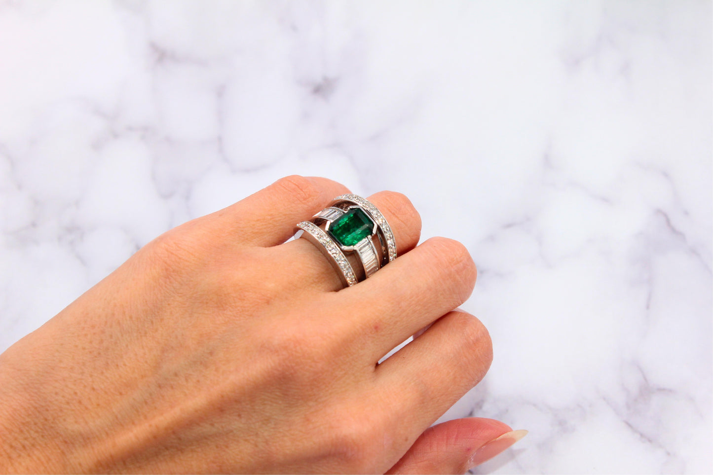 zambian emerald 18 karat white gold full finger bezel diamond baguette rows ring
